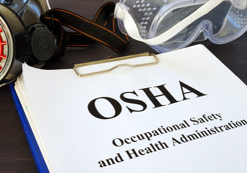 Pile of documents with Occupational Safety and Health Administration OSHA